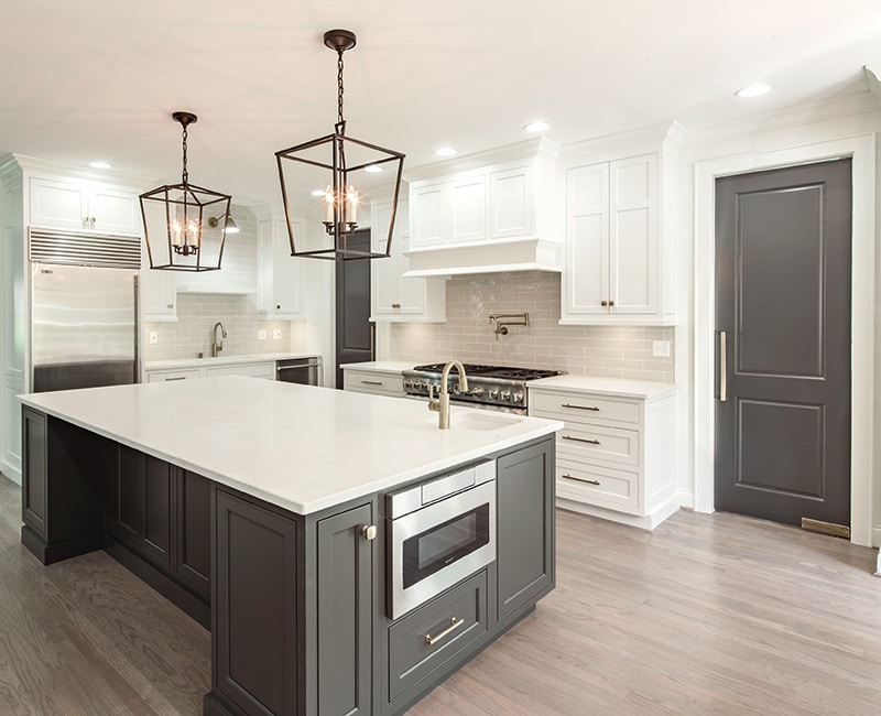 A freshly painted kitchen with coordinating cabinets, trim and interior door colours